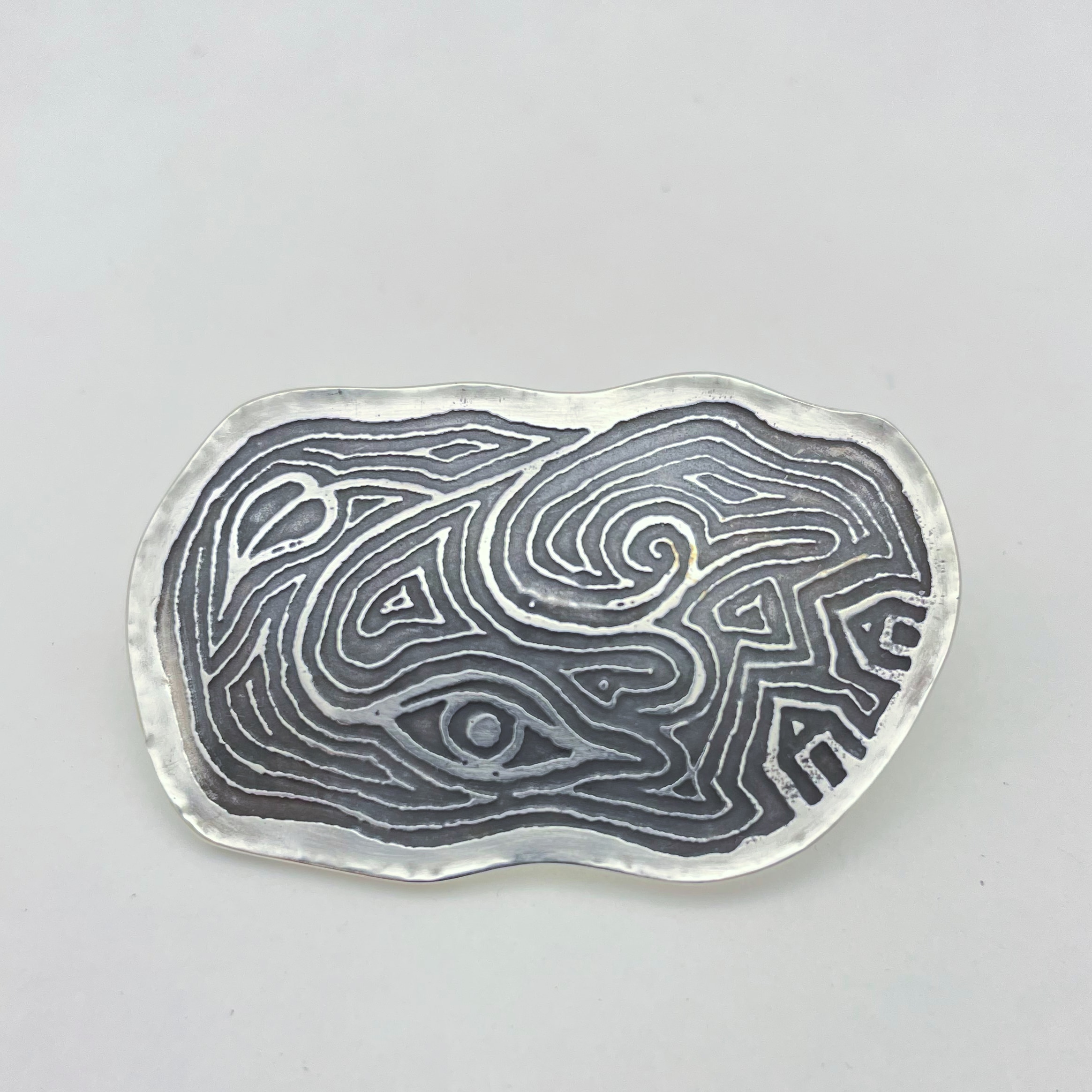 etched silver brooch